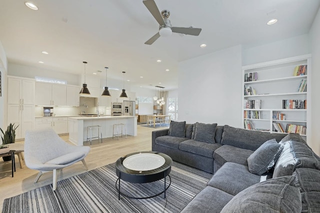 903 W Gibson St, Austin, TX 78704 - living area featuring a ceiling fan, recessed lighting, light wood-style floors, and built in shelves