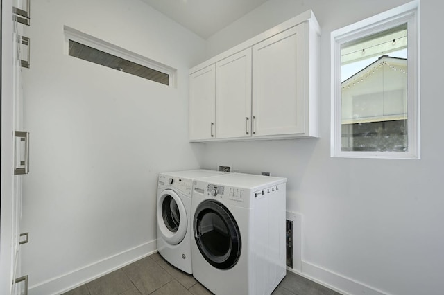 903 W Gibson St, Austin, TX 78704 - washroom featuring independent washer and dryer, cabinet space, baseboards, and dark tile patterned floors