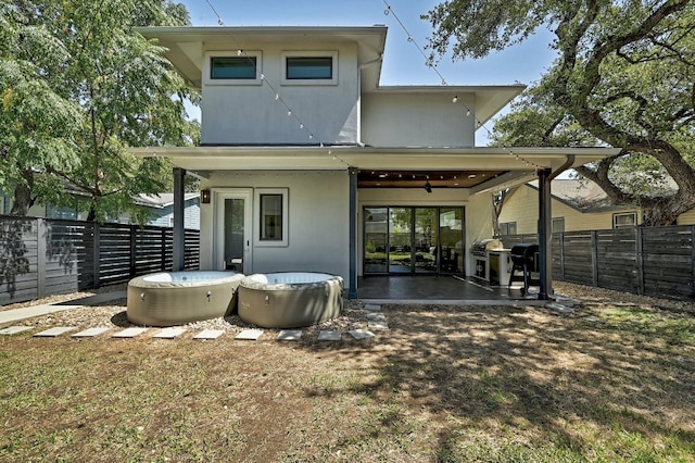 903 W Gibson St, Austin, TX 78704 - back of house featuring a fenced backyard, ceiling fan, a patio area, and stucco siding