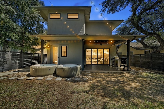 903 W Gibson St, Austin, TX 78704 - rear view of house featuring a fenced backyard, ceiling fan, stucco siding, and a patio