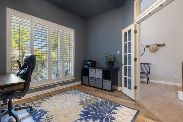 1218 Swenson Farms Blvd, Pflugerville, TX 78660 - office area featuring french doors, plenty of natural light, baseboards, and wood finished floors