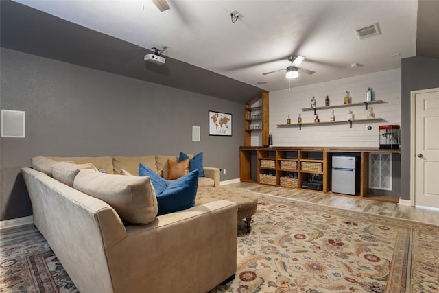 1218 Swenson Farms Blvd, Pflugerville, TX 78660 - living room with ceiling fan, vaulted ceiling, wood finished floors, baseboards, and bar area
