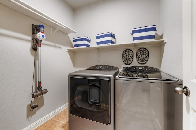 1218 Swenson Farms Blvd, Pflugerville, TX 78660 - laundry room with independent washer and dryer, baseboards, and light tile patterned flooring