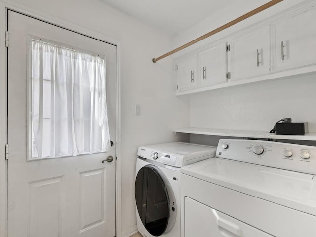 laundry room featuring washer and dryer and cabinet space