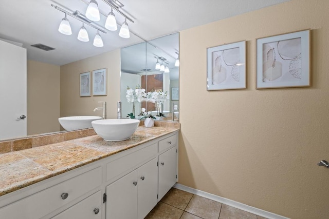 8112 W Ct, Austin, TX 78759 - bathroom with vanity, baseboards, and tile patterned flooring