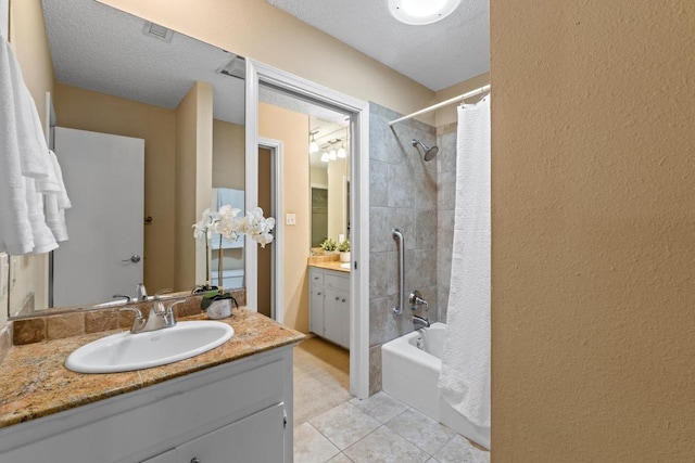 8112 W Ct, Austin, TX 78759 - full bathroom featuring shower / tub combo, vanity, tile patterned floors, and a textured wall