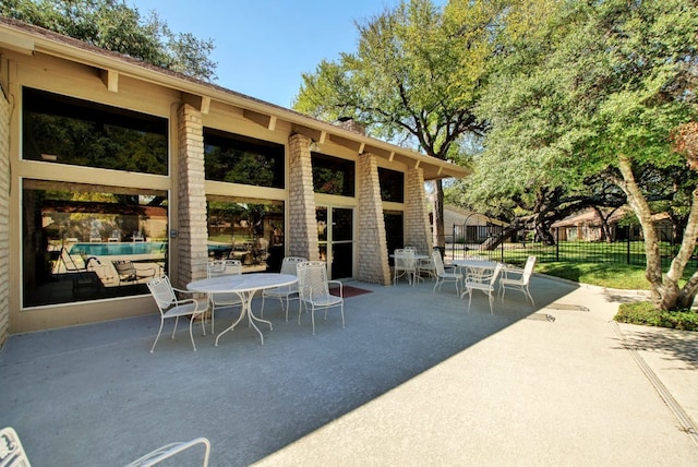 8112 W Ct, Austin, TX 78759 - view of patio featuring outdoor dining space and fence