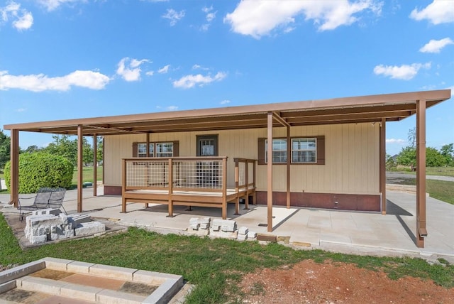 459 Mcallister Rd, Bastrop, TX 78602 - rear view of house featuring a deck