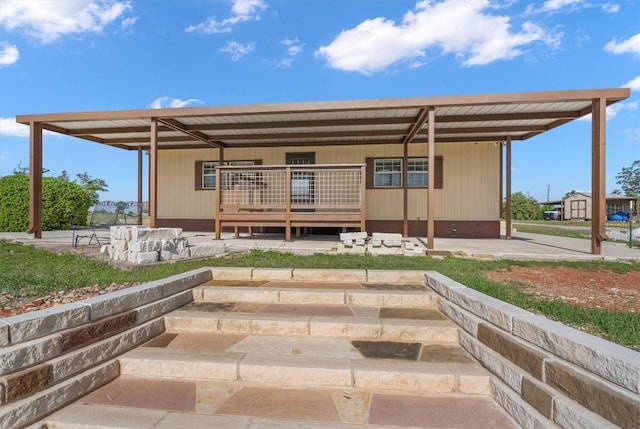 459 Mcallister Rd, Bastrop, TX 78602 - rear view of property with a carport