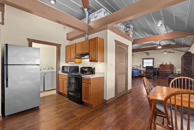 459 Mcallister Rd, Bastrop, TX 78602 - kitchen featuring black appliances, washer / dryer, a ceiling fan, under cabinet range hood, and beamed ceiling
