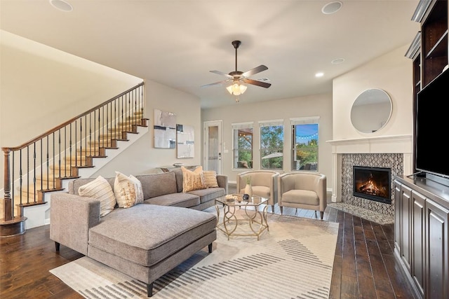 4105 Gandara Bnd, Austin, TX 78738 - living room with dark wood-type flooring, stairs, a tile fireplace, ceiling fan, and recessed lighting