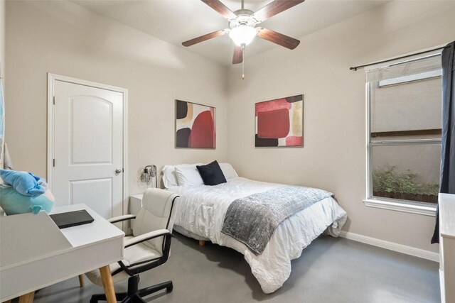 bedroom with ceiling fan and baseboards