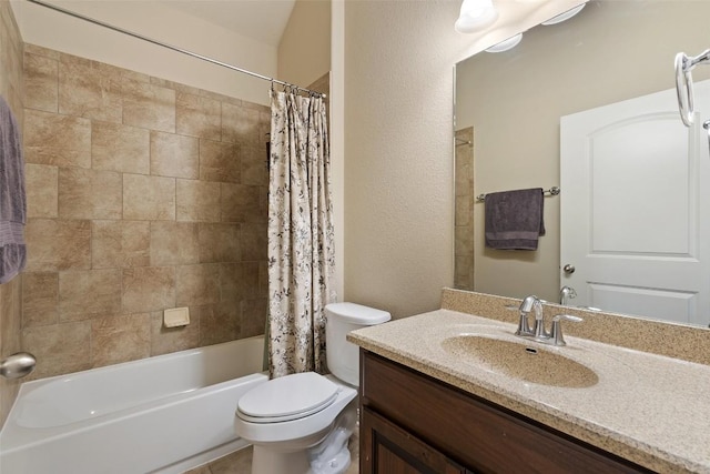 bathroom featuring toilet, vanity, a textured wall, and shower / bath combination with curtain