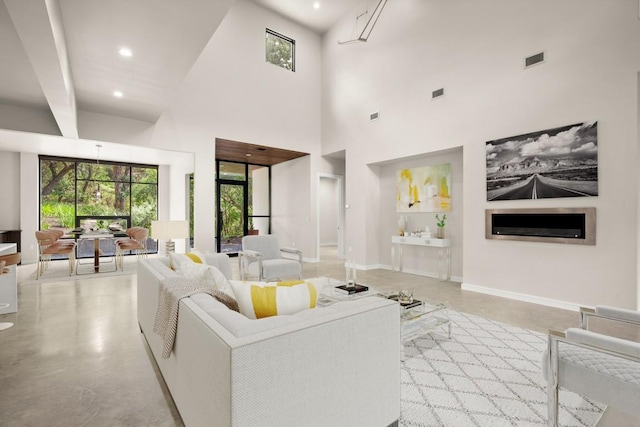 500 Laurel Valley Rd, West Lake Hills, TX 78746 - living area featuring concrete floors, a high ceiling, baseboards, and recessed lighting