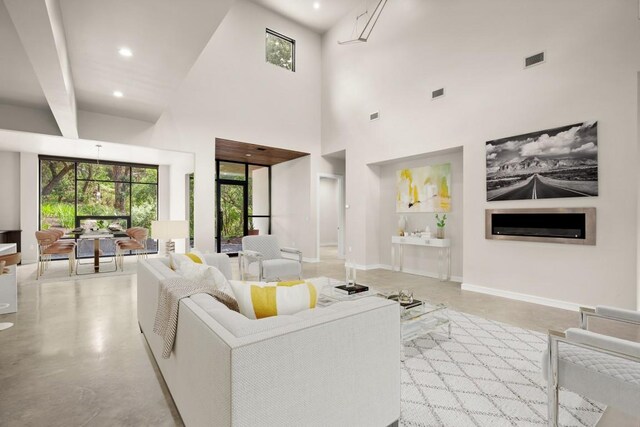 500 Laurel Valley Rd, West Lake Hills, TX 78746 - living area with finished concrete flooring, a towering ceiling, and recessed lighting