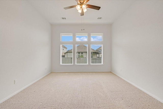 136 Gamble St, Buda, TX 78610 - spare room featuring light carpet and a ceiling fan
