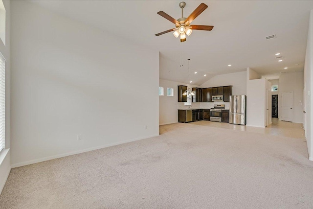 136 Gamble St, Buda, TX 78610 - unfurnished living room with vaulted ceiling, light colored carpet, a ceiling fan, and recessed lighting