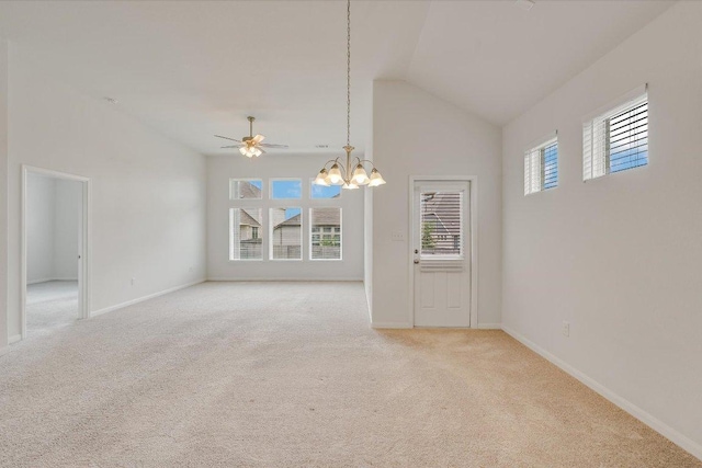 136 Gamble St, Buda, TX 78610 - unfurnished room with lofted ceiling, light carpet, a chandelier, and a ceiling fan