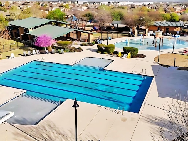 136 Gamble St, Buda, TX 78610 - community pool featuring a residential view