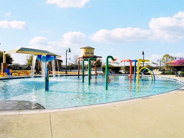 136 Gamble St, Buda, TX 78610 - community pool with a water play area