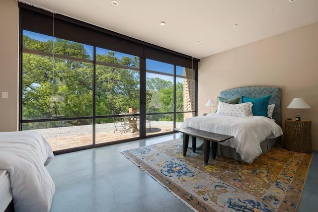 115 Seale Hill Rd, Comfort, TX 78013 - bedroom featuring floor to ceiling windows, concrete floors, and access to outside