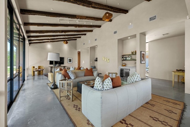 115 Seale Hill Rd, Comfort, TX 78013 - living area featuring concrete floors, visible vents, and vaulted ceiling with beams