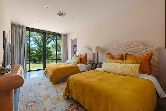 115 Seale Hill Rd, Comfort, TX 78013 - bedroom with visible vents, access to exterior, and a wall of windows