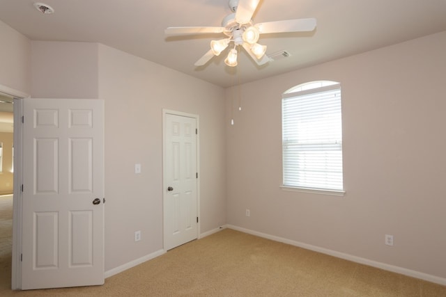 171 Brighton Ln, Austin, TX 78737 - unfurnished bedroom featuring light colored carpet and a ceiling fan