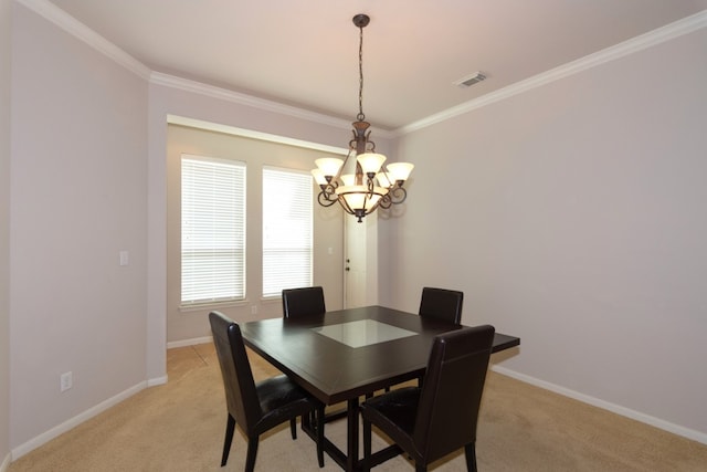 dining space featuring visible vents, light carpet, crown molding, baseboards, and a notable chandelier