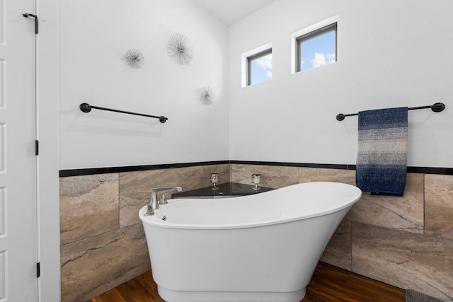 213 Pecan Meadow Ln, Harker Heights, TX 76513 - full bathroom with a freestanding tub, wainscoting, and tile walls