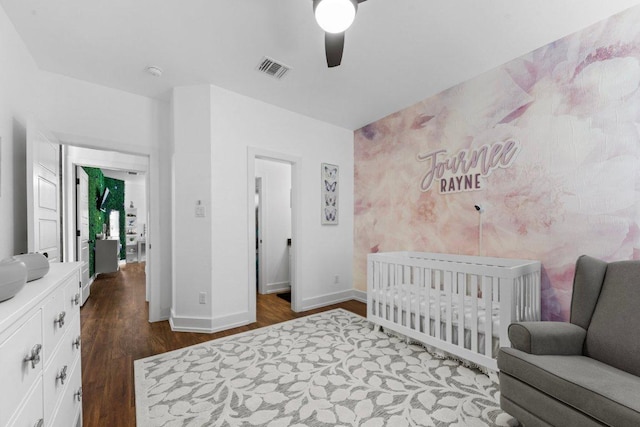 213 Pecan Meadow Ln, Harker Heights, TX 76513 - bedroom featuring visible vents, baseboards, ceiling fan, a crib, and dark wood finished floors