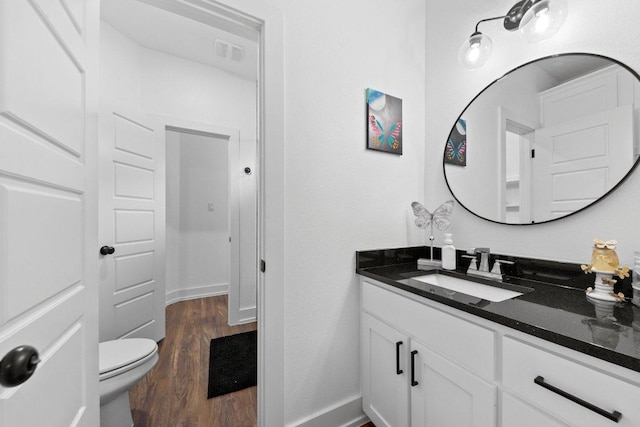 213 Pecan Meadow Ln, Harker Heights, TX 76513 - bathroom featuring vanity, visible vents, toilet, wood finished floors, and baseboards