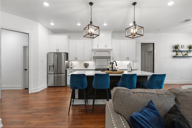 213 Pecan Meadow Ln, Harker Heights, TX 76513 - kitchen with open floor plan, visible vents, light countertops, and stainless steel fridge