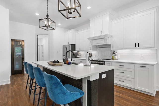 213 Pecan Meadow Ln, Harker Heights, TX 76513 - kitchen featuring tasteful backsplash, a notable chandelier, a sink, a center island with sink, and custom range hood