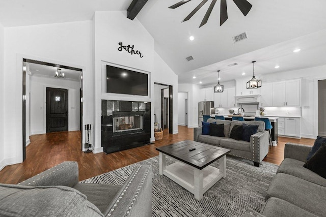 213 Pecan Meadow Ln, Harker Heights, TX 76513 - living room featuring recessed lighting, high vaulted ceiling, a multi sided fireplace, and wood finished floors