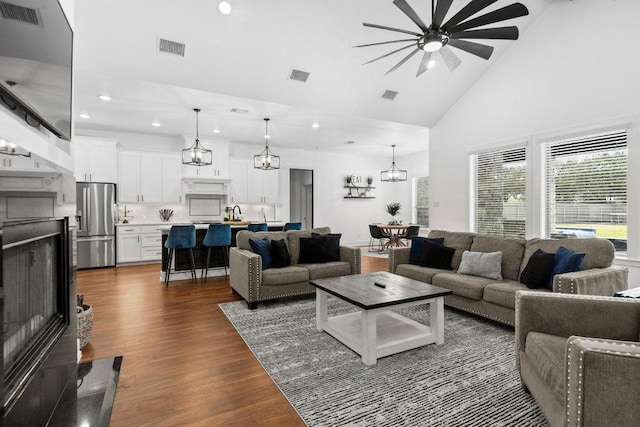 213 Pecan Meadow Ln, Harker Heights, TX 76513 - living room with ceiling fan with notable chandelier, high vaulted ceiling, and visible vents
