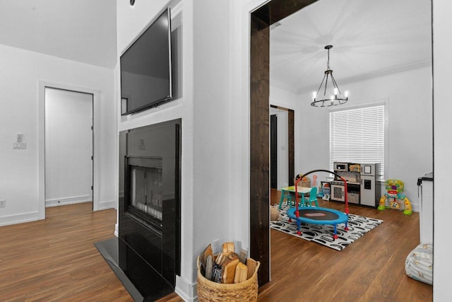 213 Pecan Meadow Ln, Harker Heights, TX 76513 - interior space with a chandelier, baseboards, ornamental molding, and wood finished floors