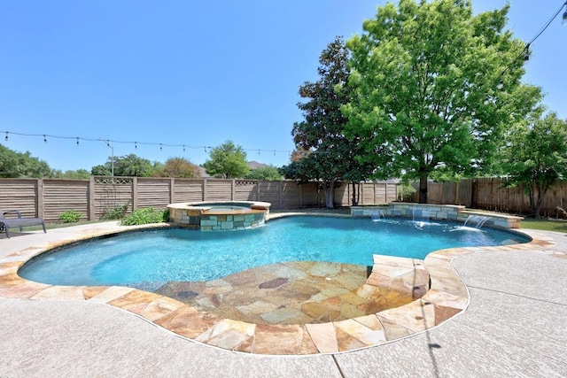 view of swimming pool featuring a fenced backyard and a pool with connected hot tub