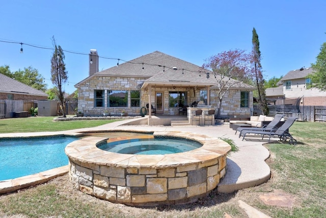 view of pool featuring a patio, a fenced backyard, an in ground hot tub, and a lawn