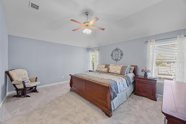 bedroom with visible vents, baseboards, ceiling fan, and light colored carpet