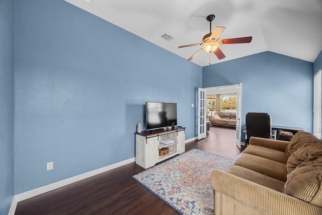 living room with ceiling fan, vaulted ceiling, visible vents, wood finished floors, and baseboards