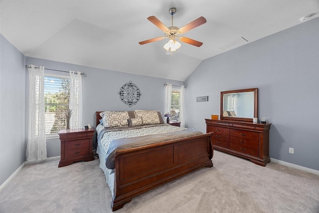 bedroom with light carpet, visible vents, baseboards, and vaulted ceiling