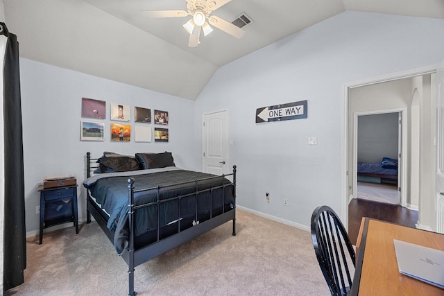 bedroom with visible vents, baseboards, a ceiling fan, carpet floors, and vaulted ceiling