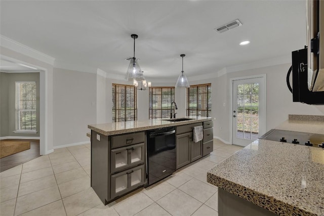 kitchen featuring light tile patterned floors, black appliances, a sink, baseboards, and visible vents