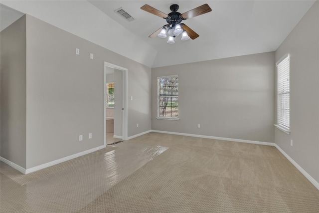 empty room featuring visible vents, ceiling fan, baseboards, and light carpet