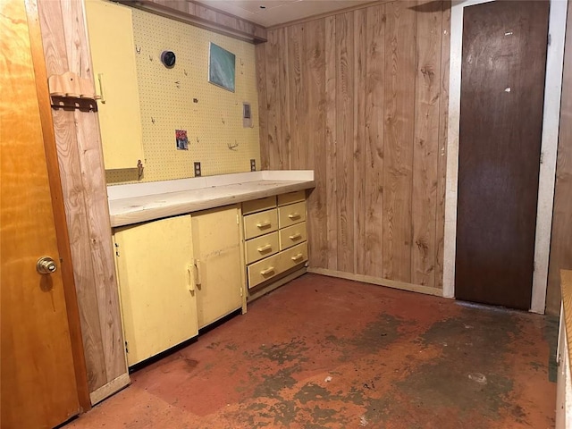 1006 Gilmore St, Taylor, TX 76574 - bathroom with wooden walls, unfinished concrete flooring, and double vanity