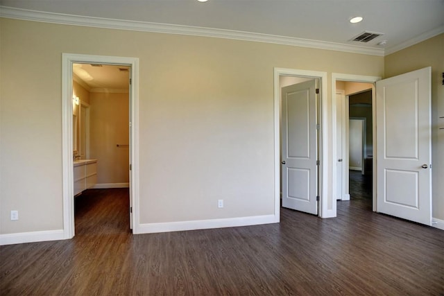 159 Alele Dr, Bastrop, TX 78602 - unfurnished bedroom featuring dark wood finished floors, ornamental molding, and recessed lighting