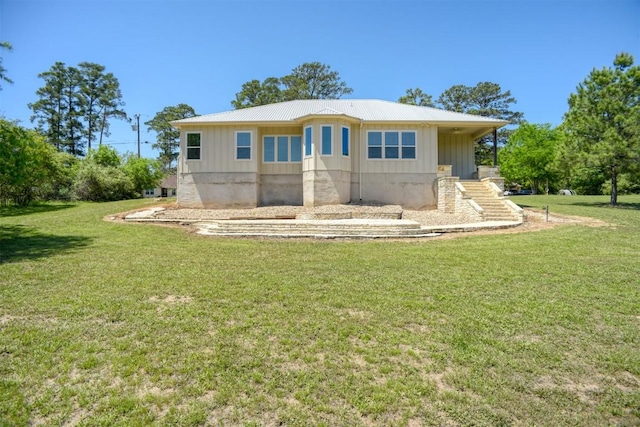 159 Alele Dr, Bastrop, TX 78602 - view of front of home featuring board and batten siding and a front lawn