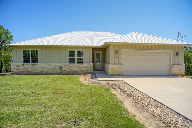 159 Alele Dr, Bastrop, TX 78602 - ranch-style home featuring board and batten siding, stone siding, an attached garage, concrete driveway, and a front yard