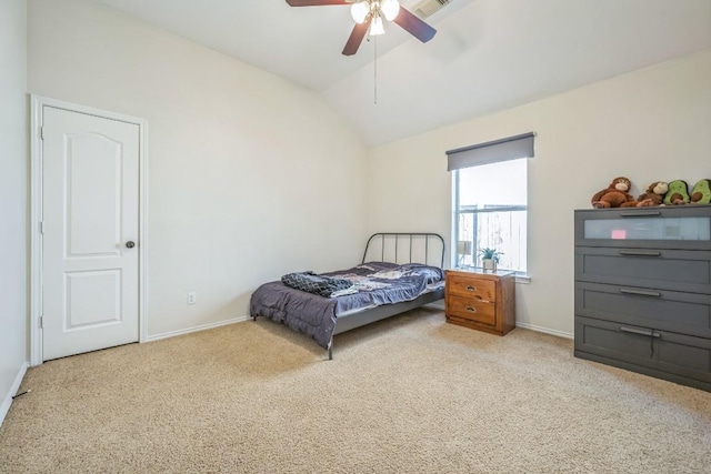 carpeted bedroom featuring ceiling fan, baseboards, and vaulted ceiling